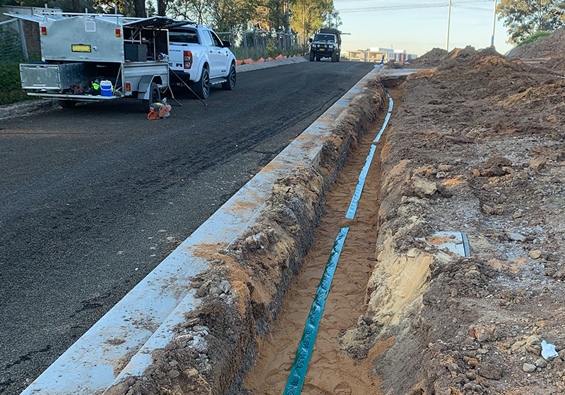 Sewer pipe fully encased in concrete